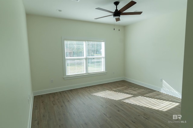 unfurnished room featuring ceiling fan and wood-type flooring