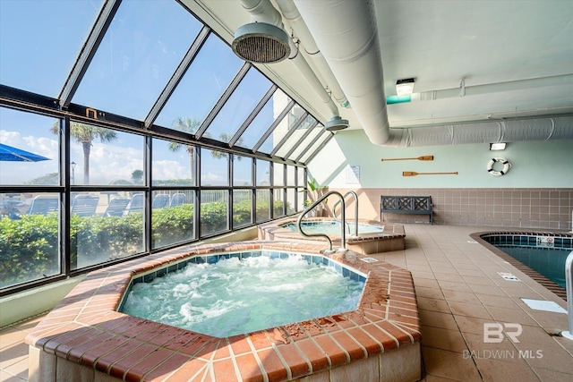 community pool featuring an indoor hot tub