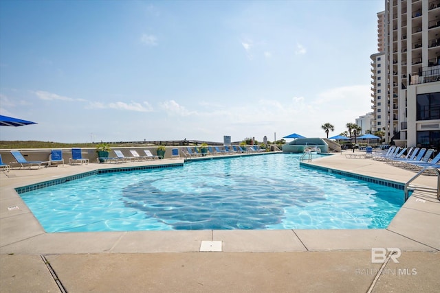 pool with a patio area