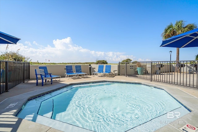 view of pool featuring a patio area and fence