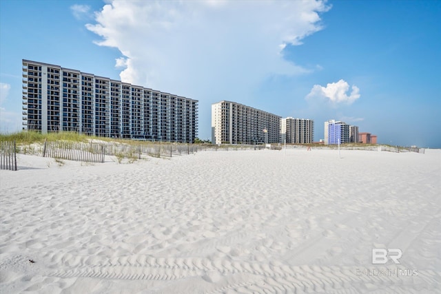 view of property with a city view and a beach view