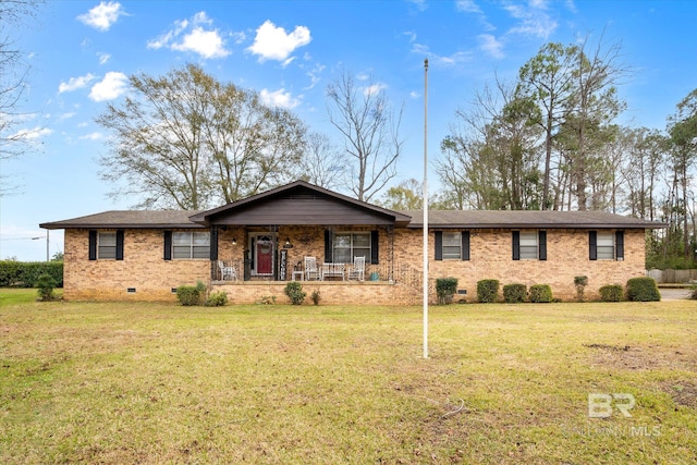 single story home with covered porch and a front lawn