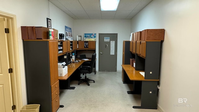 office area with a paneled ceiling