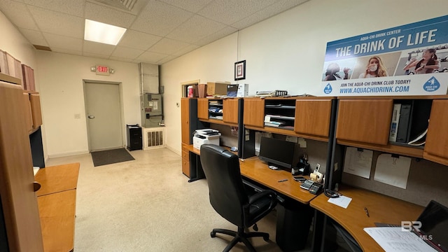 office space featuring a drop ceiling and light colored carpet