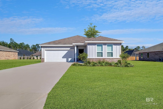 single story home with a front yard, driveway, a garage, and board and batten siding