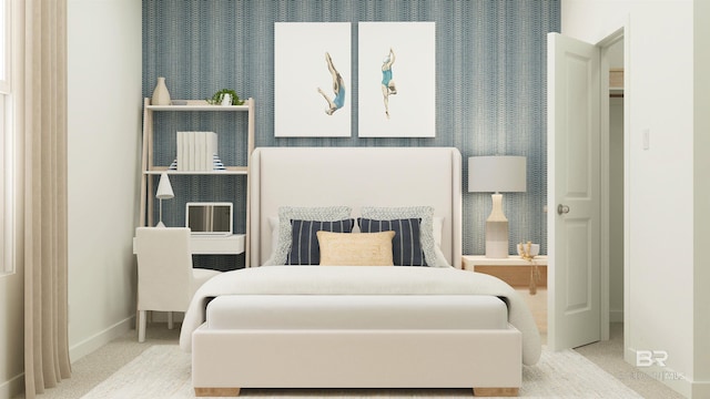 carpeted bedroom featuring baseboards