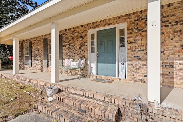 doorway to property featuring covered porch