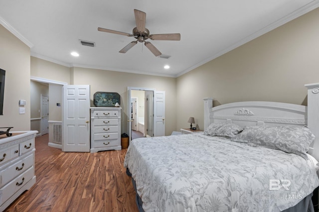 bedroom with ornamental molding, dark hardwood / wood-style floors, and ceiling fan