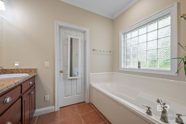 bathroom with vanity, ornamental molding, a bathtub, and tile patterned flooring