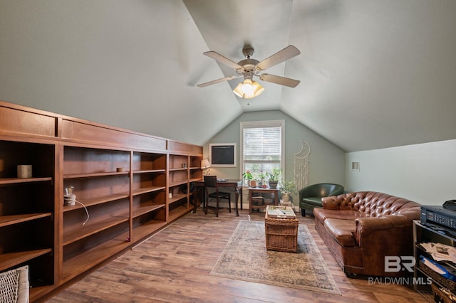 interior space featuring lofted ceiling, wood-type flooring, and ceiling fan