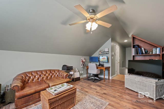 office area with lofted ceiling, hardwood / wood-style floors, and ceiling fan