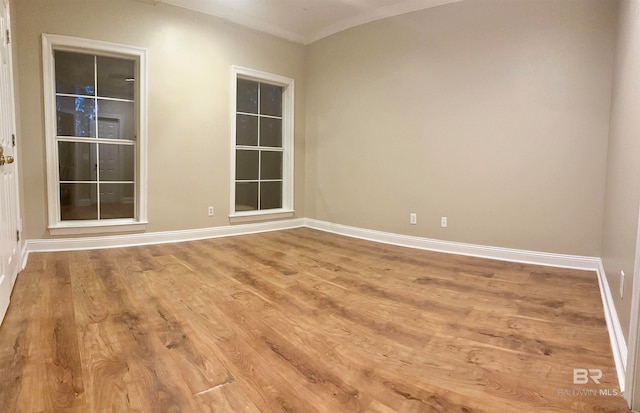 spare room featuring light hardwood / wood-style floors