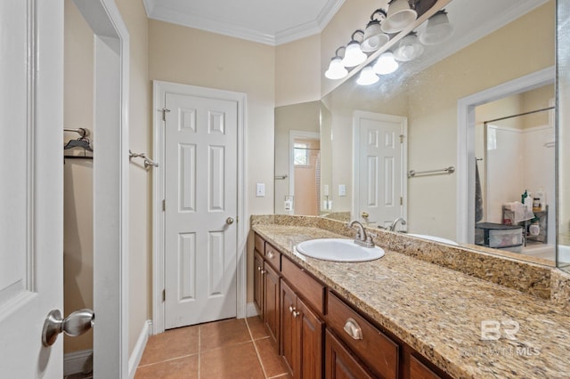 bathroom featuring vanity, crown molding, and tile patterned flooring