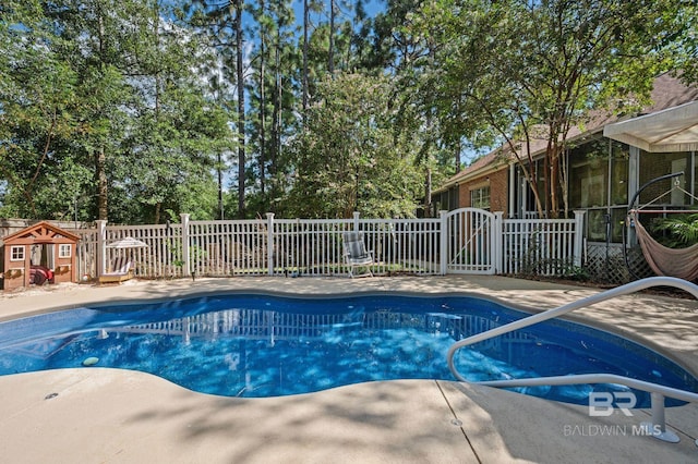 view of swimming pool featuring a patio area