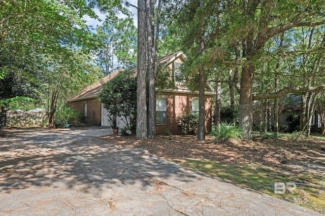 view of property hidden behind natural elements