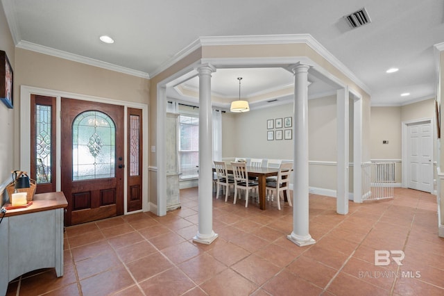 entrance foyer featuring ornamental molding and light tile patterned floors