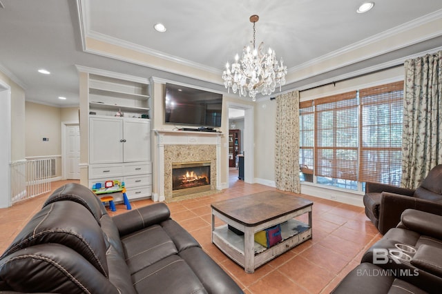 tiled living room featuring crown molding, an inviting chandelier, and a high end fireplace