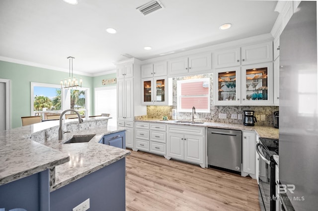 kitchen with white cabinets, stainless steel appliances, and a sink