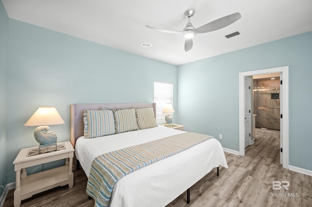 bedroom with ceiling fan, visible vents, baseboards, and wood finished floors