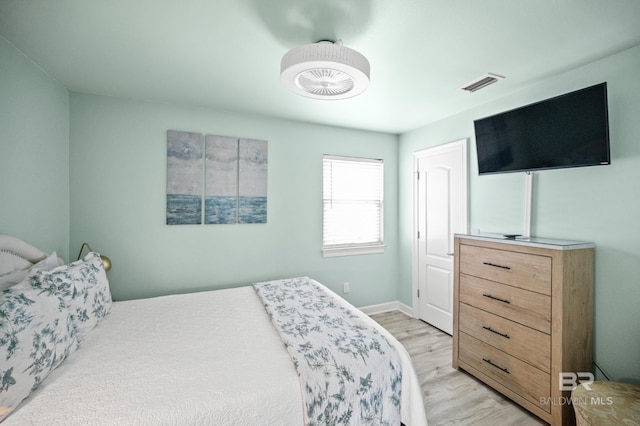 bedroom featuring visible vents and light wood-type flooring