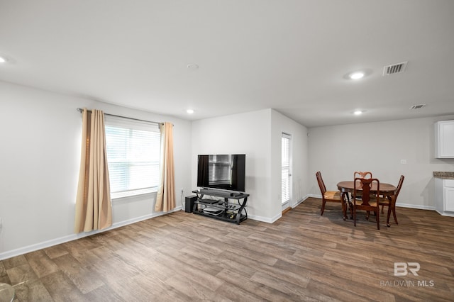 dining room with hardwood / wood-style flooring