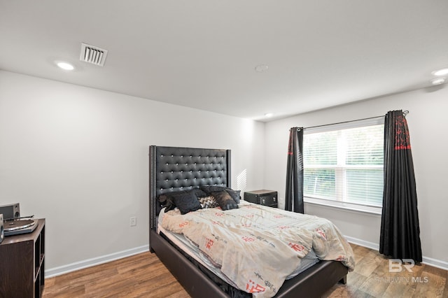 bedroom featuring hardwood / wood-style floors