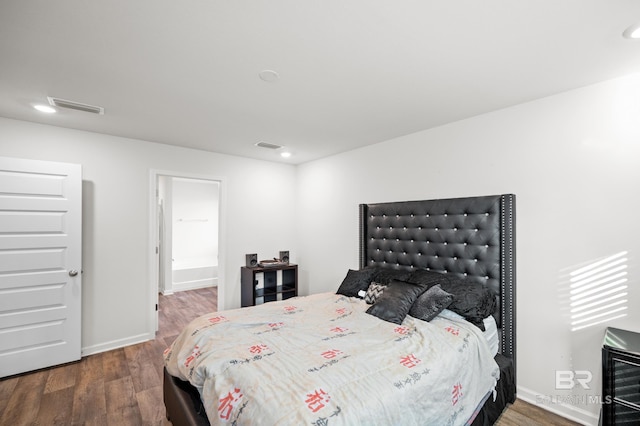 bedroom featuring dark wood-type flooring