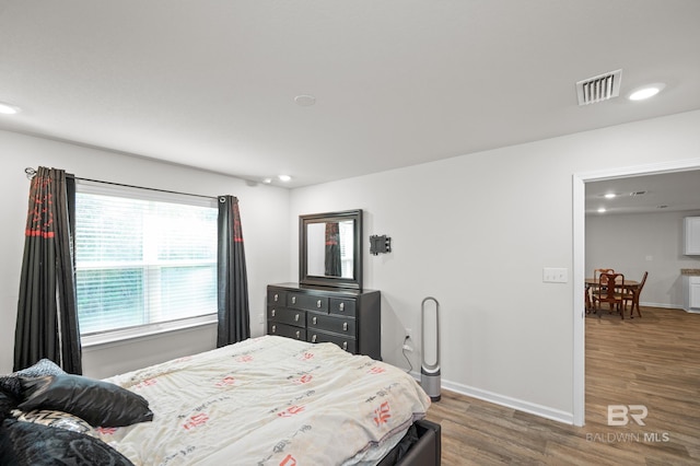 bedroom featuring dark wood-type flooring