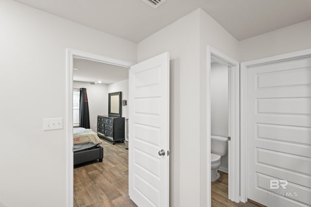 corridor featuring hardwood / wood-style floors