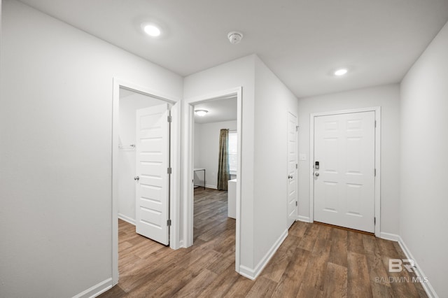 corridor featuring dark hardwood / wood-style floors