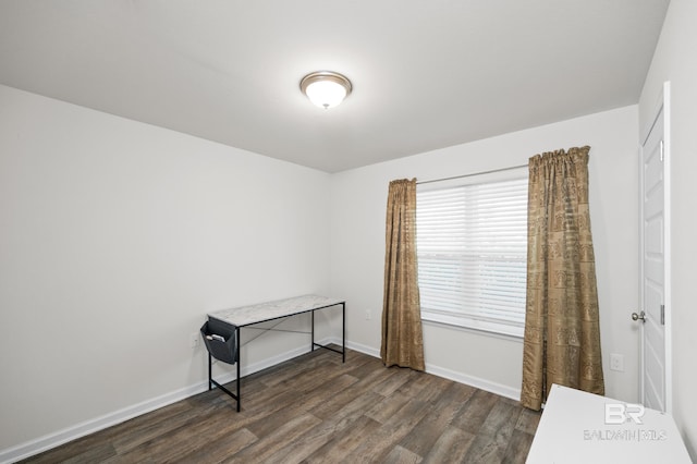 empty room with dark wood-type flooring