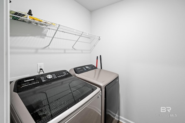 washroom with independent washer and dryer