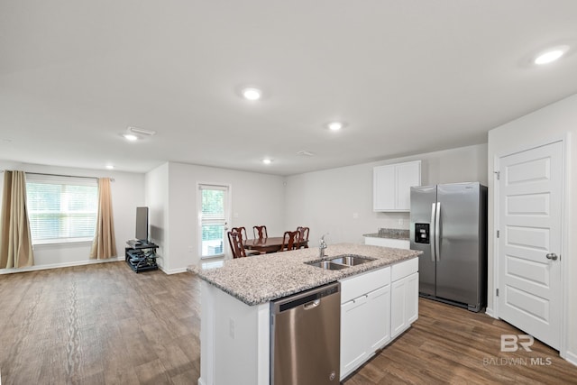 kitchen with a center island with sink, a wealth of natural light, sink, white cabinetry, and appliances with stainless steel finishes