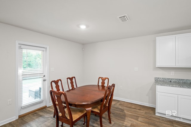 dining area featuring dark hardwood / wood-style floors