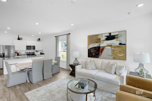 living room with light hardwood / wood-style flooring