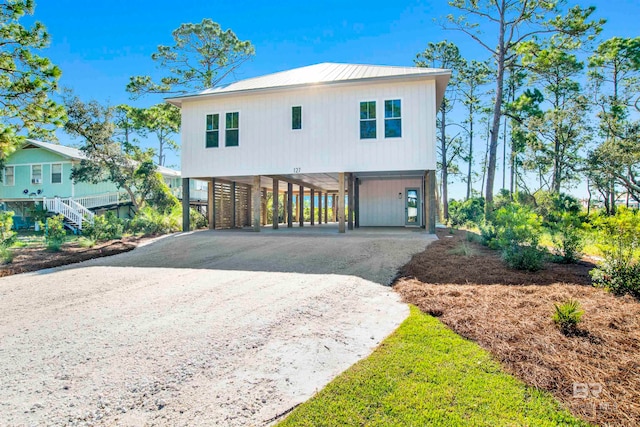 view of front of home with a carport