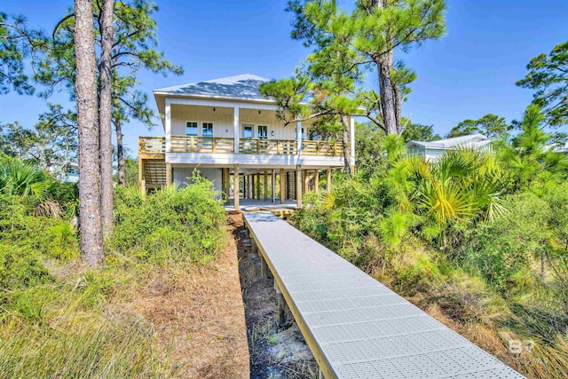 rear view of property with stairway