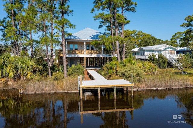 dock area featuring a water view and stairway
