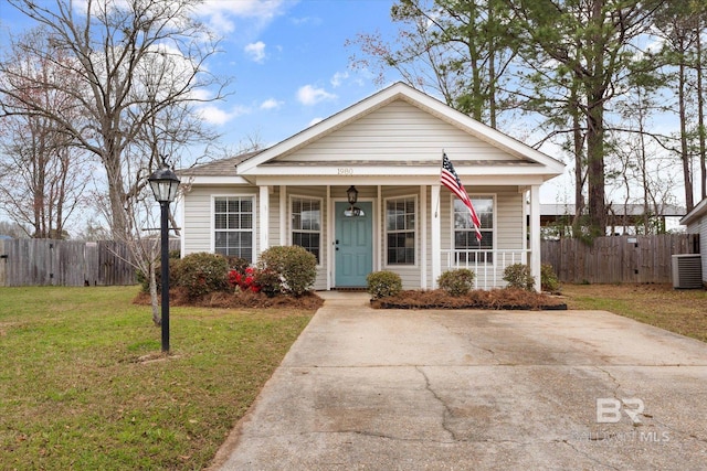 bungalow-style house with covered porch, central AC, a front yard, and fence