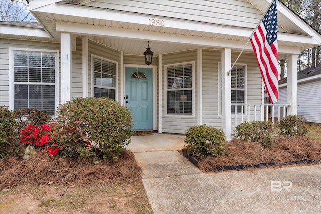 doorway to property with a porch