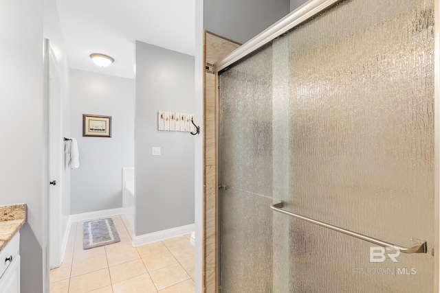 bathroom with shower with separate bathtub, tile patterned floors, and vanity