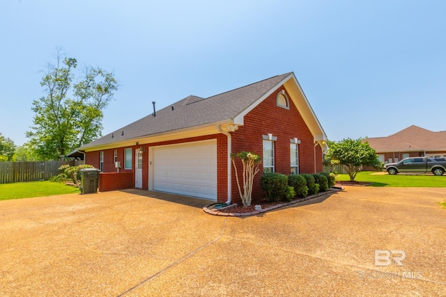 view of side of home with a garage