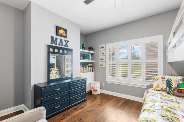 bedroom with ceiling fan and dark hardwood / wood-style flooring