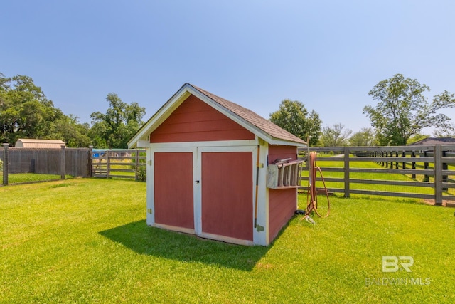 view of outbuilding featuring a yard