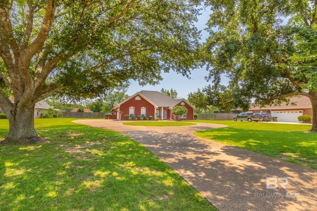 ranch-style house featuring a garage and a front lawn