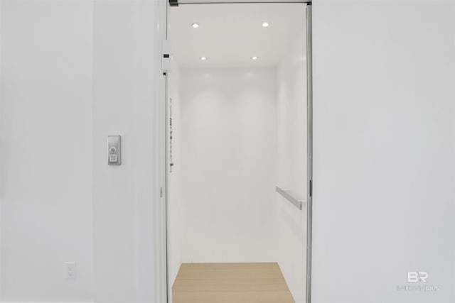 interior space with elevator and recessed lighting