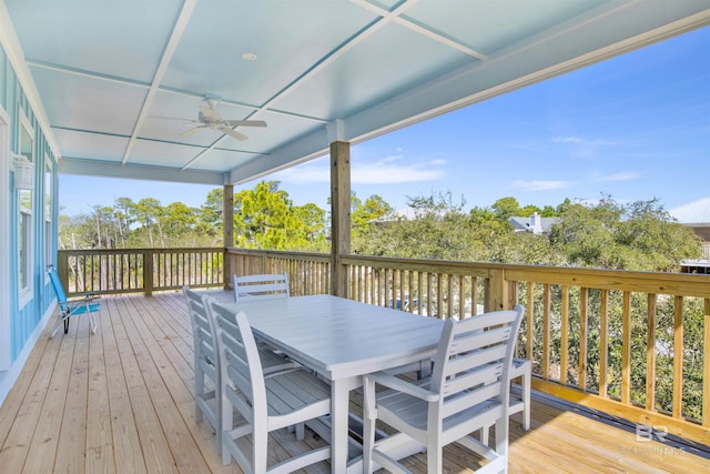 deck with outdoor dining space and ceiling fan