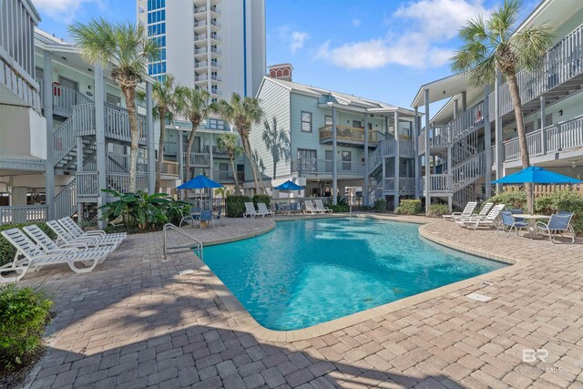 507 W Beach Blvd Unit 402, Gulf Shores, AL 36542 - view of swimming pool featuring a patio