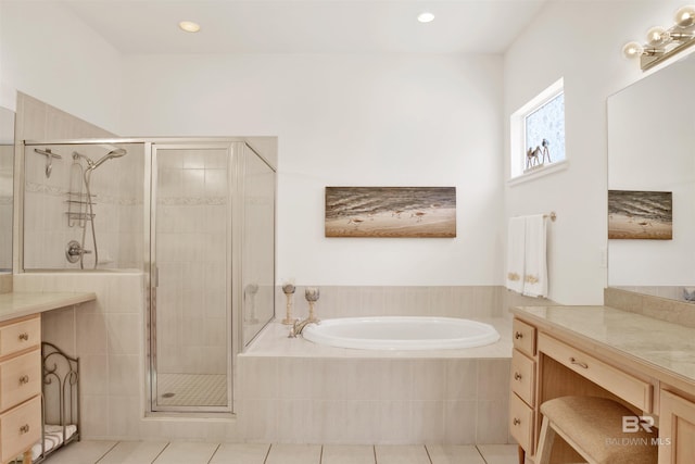 bathroom featuring a garden tub, tile patterned flooring, recessed lighting, vanity, and a shower stall