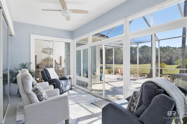 sunroom featuring a ceiling fan